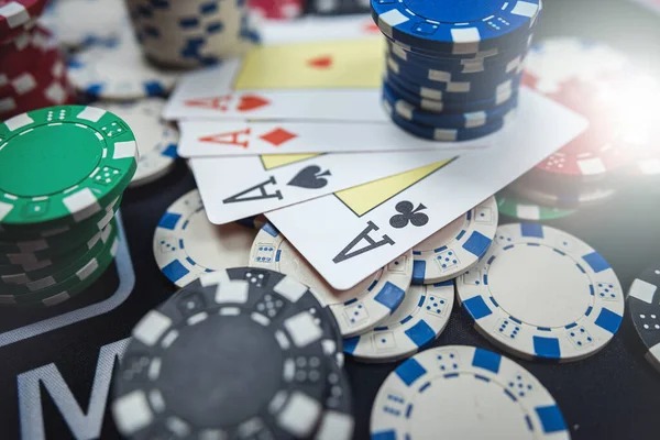 Live blackjack dealer showing cards to multiple players